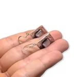Authentic Tuareg artisan silver earrings close up