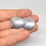 Handmade African spiral silver earrings close up