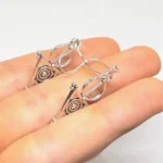 Moroccan silver earrings inspired by Berber Tazerzit fibula